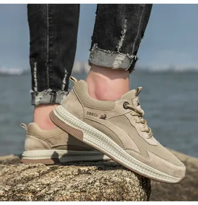 Detail of breathable leather mesh sneaker for men on seaside rocks during outdoor walk