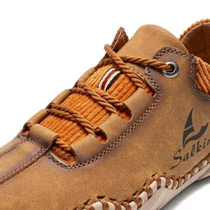 Close-up of men's casual leather shoe with textured fabric and vintage rope laces