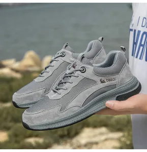 Detail showing grey leather mesh sneakers with non-slip rubber soles and durable laces