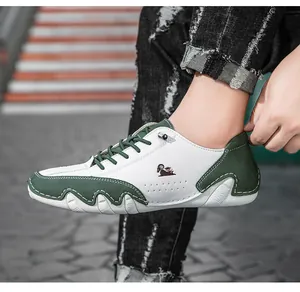Close-up of stylish color-blocked sneakers featuring a unique wavy sole and animal logo