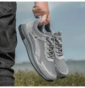 Detail of grey mesh and leather casual sneaker featuring breathable texture and anti-slip sole