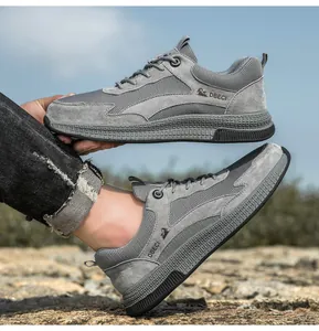 Close-up of grey leather and mesh sneakers showing breathable texture and durable sole