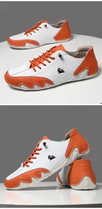 Detailed close-up showing orange and white leather stitching on men's casual shoes
