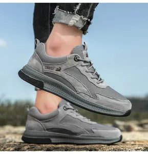 Detail of grey leather and mesh sneakers featuring breathable fabric and durable rubber soles
