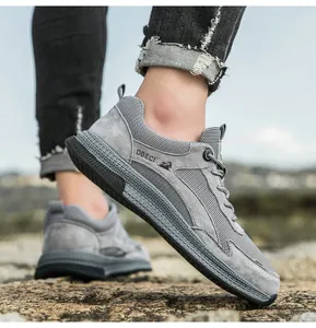 Macro detail of breathable grey mesh and leather sneakers with durable non-slip soles