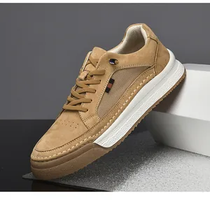Detail of khaki suede leather sneakers featuring signature striped webbing and thick rubber sole