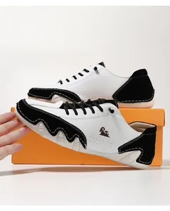 Detail of men's casual leather shoes with black and white contrast and wave sole