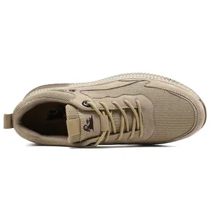 Close-up of tan suede and mesh texture on breathable men's casual sneakers