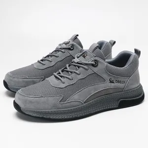Close-up of grey breathable mesh and matte leather texture on the men's casual sneaker