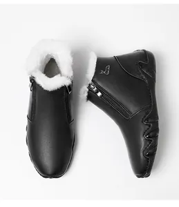 Detail view of winter ankle boots with warm white faux fur lining and side zipper closure