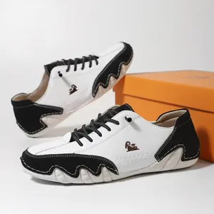 Men's low-top casual shoes in black and white leather with a unique wavy rubber sole