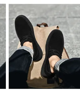 Close-up of black matte suede casual shoes with thick rubber sole on a canvas backpack