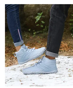 Close-up of light blue outdoor snow boots with warm faux fur lining and anti-slip soles