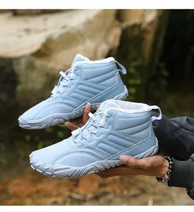 Detail view of light blue winter boots featuring warm plush lining and anti-slip rubber sole