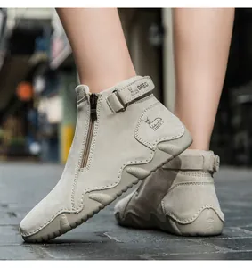 Detail showing the side zipper and adjustable hook-and-loop strap on a beige leather boot