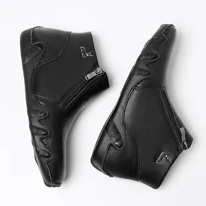Vintage black genuine leather Martin boots for women featuring side zipper and metal logo