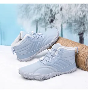 Detail of light blue winter snow boots with thick plush lining and anti-slip rubber sole