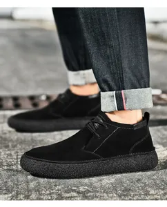 Detail view of black suede casual shoes with thick anti-slip rubber soles and lace-up design