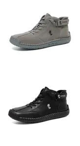 Details von grauen Wildleder- und schwarzen Leder-High-Top-Boots mit robusten Gummisohlen