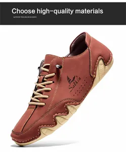 Detail of brown leather boat shoe showing salkin logo and wave-shaped rubber sole