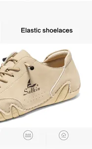 Detail of beige casual boat shoe featuring elastic shoelaces and breathable side perforations