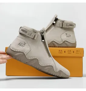 Detail shot of khaki leather high-top boots with side zipper and velcro strap closure
