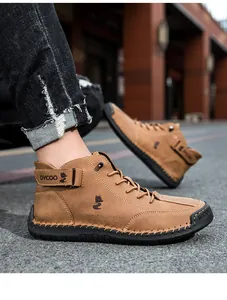 Detail of brown high-top casual boots featuring stitching and durable rubber soles