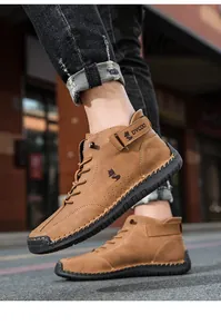Close-up of brown high-top casual boots featuring durable rubber soles and stitching detail