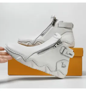 Detail shot of white leather high-top boots featuring side zipper and chunky wavy sole