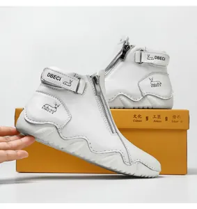 Detailed side view of white leather high-top boots with zipper and buckle strap