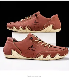 Detailed close-up of brown leather boat shoe with yellow laces and white sole