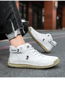 Close-up of white high-top men's shoes with red fox logo and durable hand-stitched rubber soles