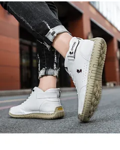 Detailed view of high-top casual sneakers featuring white leather and durable gum rubber sole
