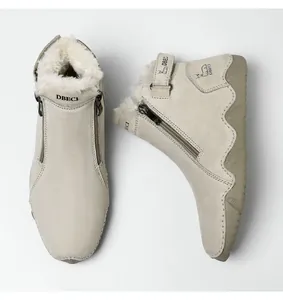 Detail view of winter warm leather boots featuring thick fleece lining and side zipper