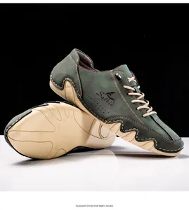 Close-up of dark green suede boat shoes with beige soles and contrast stitching details