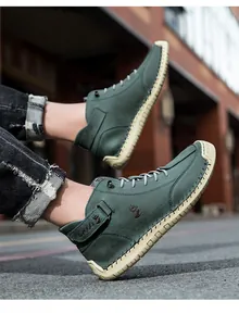 Detail of forest green high-top men's shoes with leather texture and thick yellow sole
