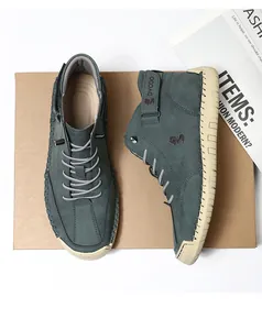 Detailed overhead shot of men's dark green high-top sneakers with hand-stitched rubber soles