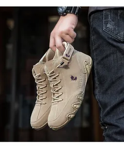 Macro detail of khaki high-top tactical boots with suede finish and secure grip sole