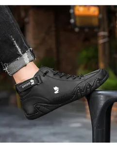 Detail of black leather casual shoes with velcro strap and octopus textured sole