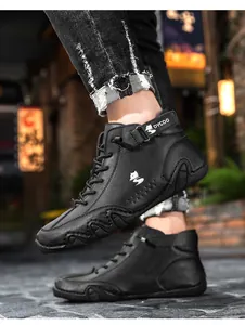 Detail of high-top leather sneakers featuring a fox logo and anti-slip rubber outsole