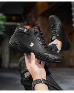 Detail of high-top leather sneaker with wavy rubber sole and ankle strap branding