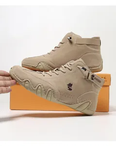 Close-up of khaki high-top casual sneakers with suede texture and durable rubber sole
