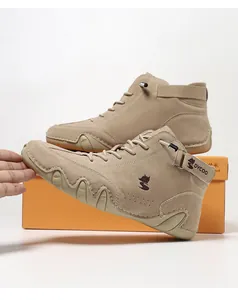 Close-up of khaki suede high-top shoes featuring fox embroidery and flexible rubber soles