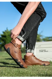 Detailed side view of brown leather casual boots with Velcro strap and non-slip rubber sole