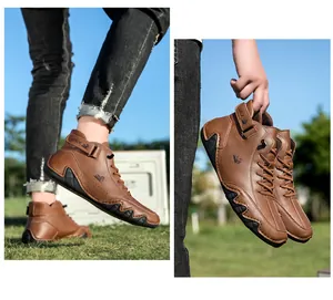 Detail of brown high-top casual boots with side perforations and velcro strap