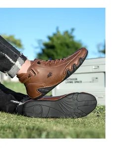 Detail of men's brown high-top casual boots featuring durable wave-edged rubber soles