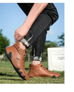 Detail of brown high-top casual boots featuring leather texture and hook-and-loop closure