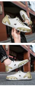 Détails de chaussures en cuir bicolore avec logo de chèvre et coutures faites à la main