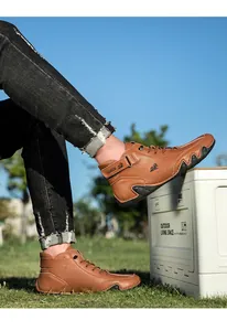 Outdoor shot of brown leather casual boots with LDECK logo on black non-slip rubber soles