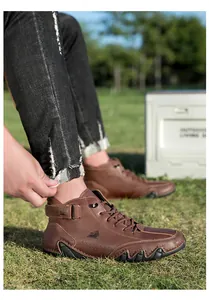 Close-up of brown grain leather men's ankle boots with velcro strap and ldeck logo